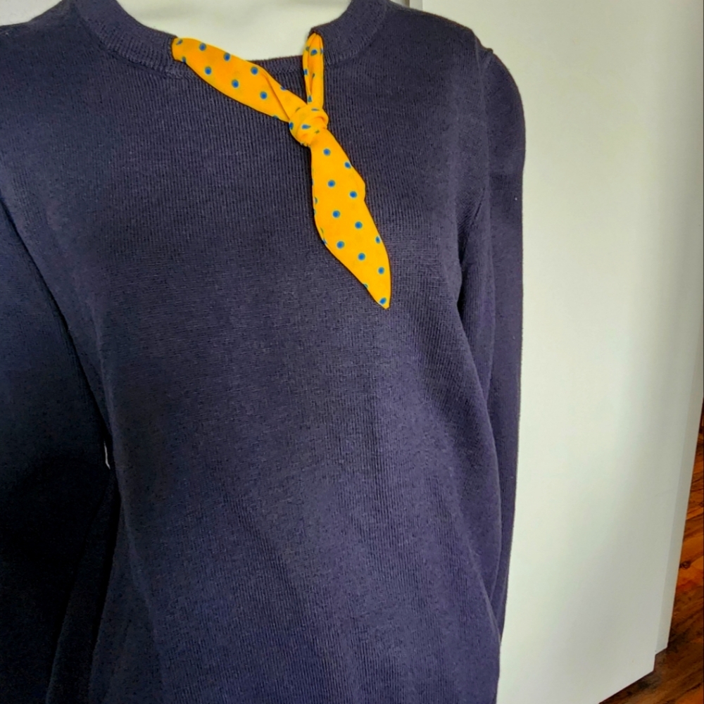 Navy sweater with yellow scarf accent